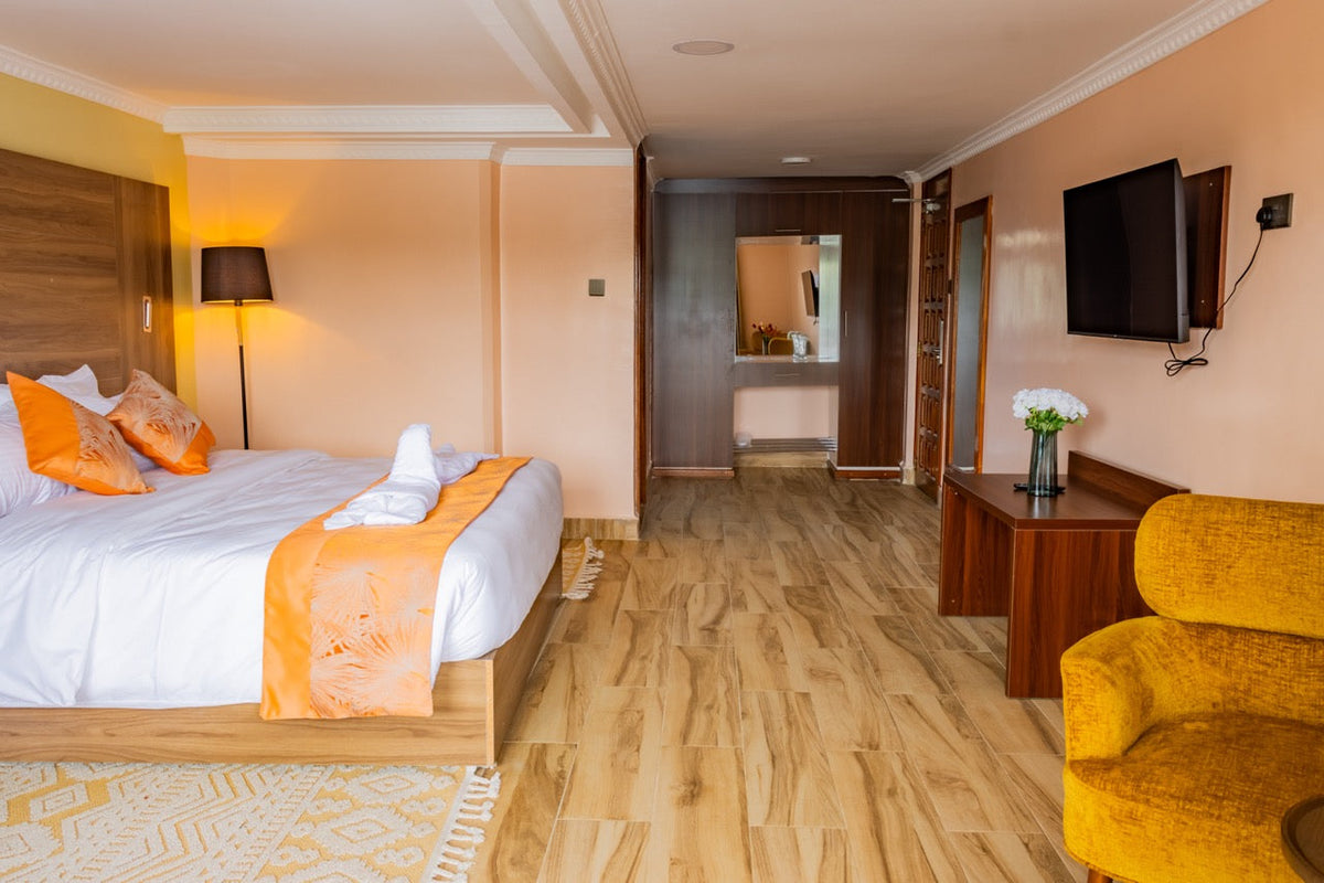 Calm guest room with armchair and wide view at Karen Plains Hotel, a base for October walks and drives in Karen, Nairobi