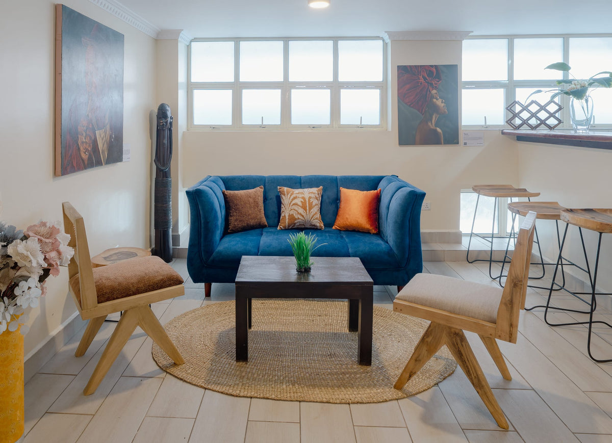Blue sofa by the window in the shared lounge at Karen Plains Hotel, Karen, Nairobi, a base for a cultural October