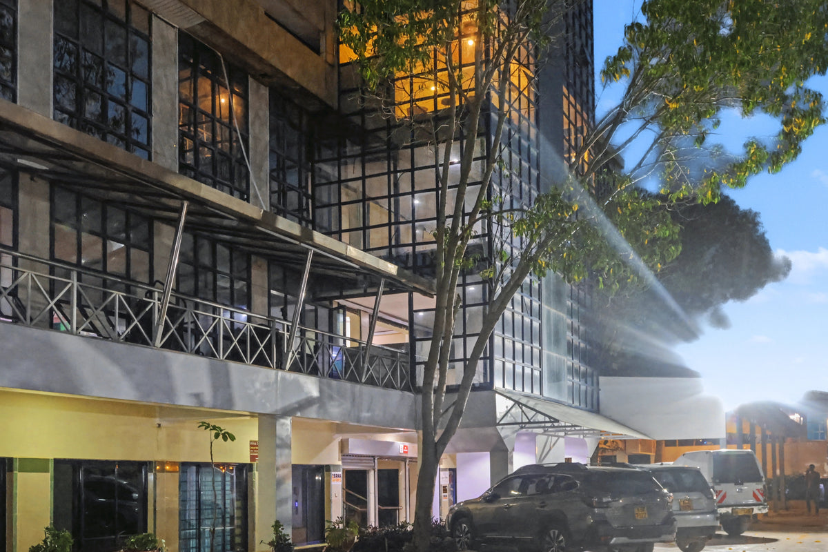 Karen Plains Arcade exterior at dusk, home of Karen Plains Hotel in Karen, Nairobi, a base for Mashujaa Day